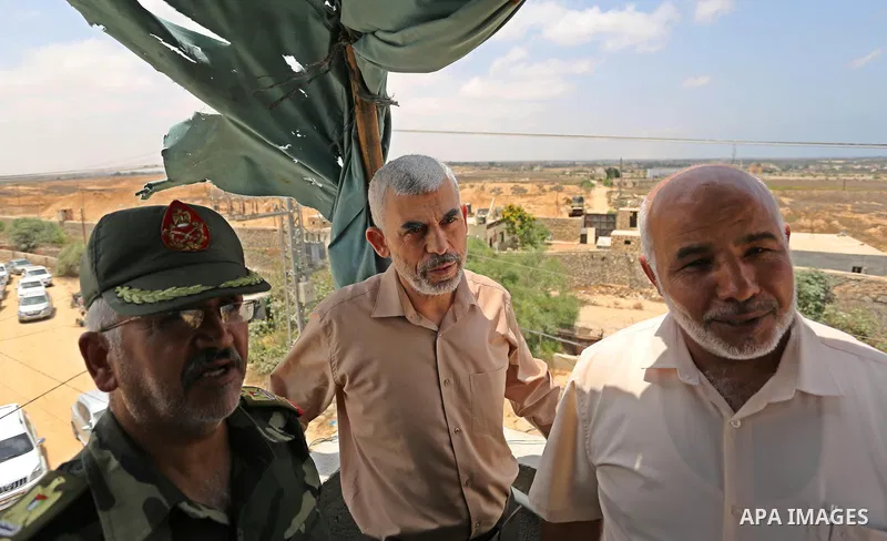 FILE PHOTO:Yahya Sinwar the new leader of the Hamas Islamist movement in the Gaza Strip inspects a section of the border with Egypt, in the southern Gaza strip town of Rafah, on July 6, 2017. The buffer zone is expected...