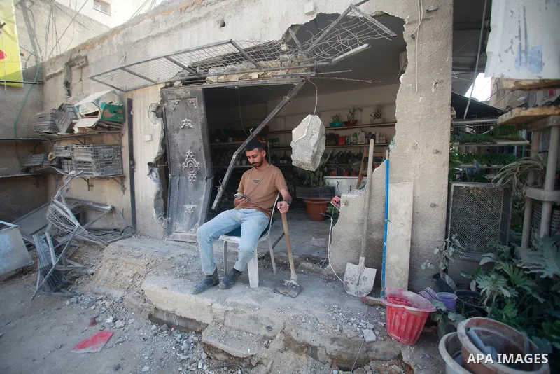 Palestinians walk past an office of UNRWA demolished by Israeli forces in the Nur Shams camp, east of Tulkarm city in the northern West Bank, on Nov. 02, 2024. The Israeli army on Thursday demolished the office of the Un...