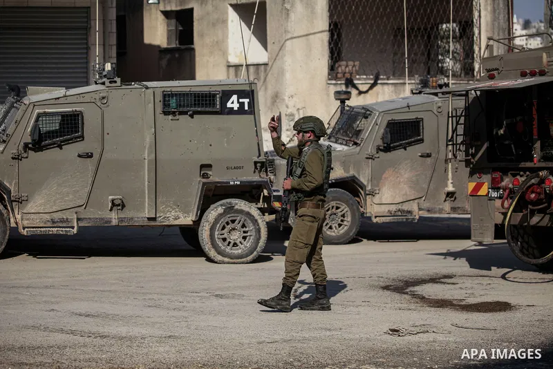 Israeli soldiers reacts during a raid carried out by Israeli forces in the West Bank city of Tulkarem, 07 November 2024. According to the Palestinian Health Ministry in the West Bank, at least one Palestinian was killed...