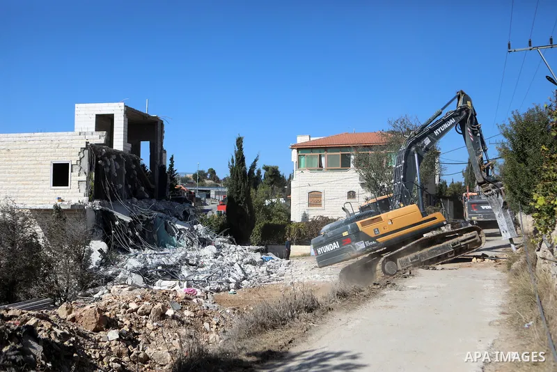 Israeli forces, accompanied by bulldozers, raid and demolish a Palestinian house on the grounds that it was 'unlicensed' in Beit Ummar, Hebron, West Bank on November 13, 2024. Photo by Mamoun Wazwaz\ apaimages