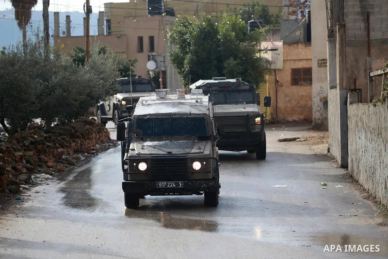 Israeli army forces raided the village of Salem, east of the city of Nablus, in the northern West Bank, and raided homes in the village in search of those wanted by the Israeli army and closed the street, 19 November 202...