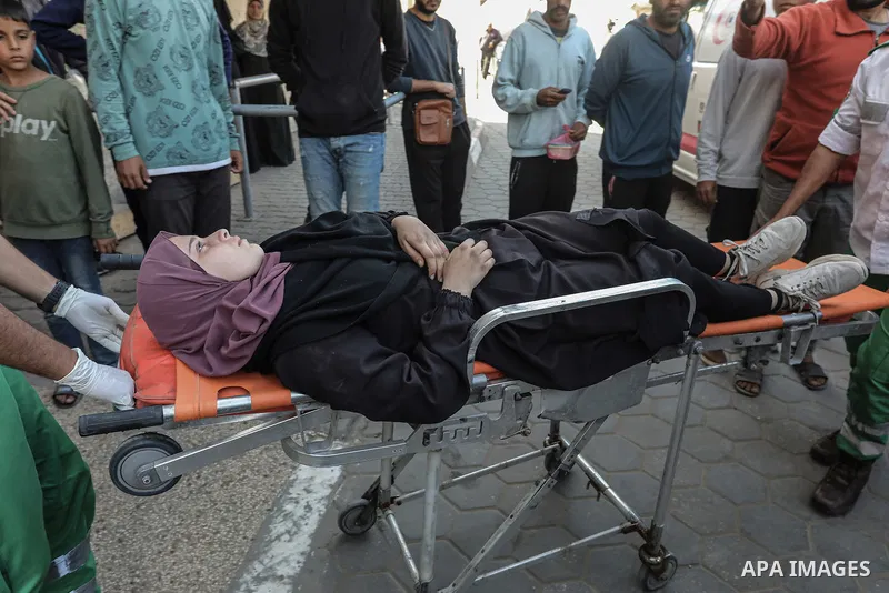Displaced Palestinians arrive at Al-Aqsa Martyrs Hospital in Deir al-Balah to receive treatment after fleeing from the north of Gaza City to the central Gaza Strip, due to the ongoing Israeli attacks and the lack of food...