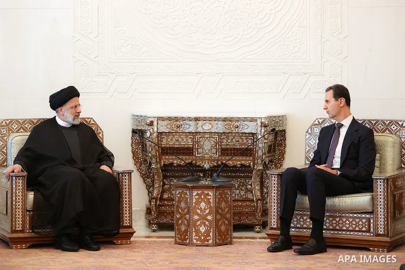 (FILES) Iranian President Ebrahim Raisi meets with Syria's President Bashar al-Assad in Damascus on May 3, 2023. The visiting Iranian president hailed al-Assad for overcoming sanctions and achieving "victory" in the coun...