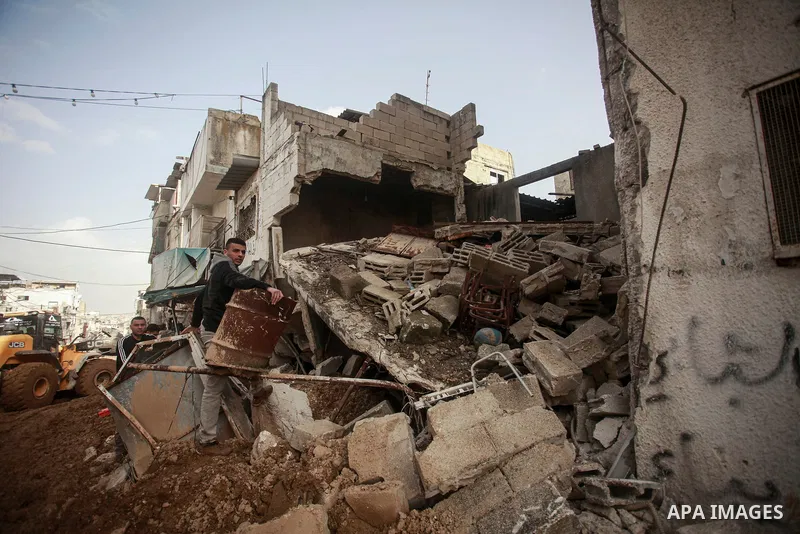 Palestinians inspect the damage at Tulkarem refugee camp, near the West Bank city of Tulkarem, 26 December 2024. At least eight Palestinians have been killed since Israeli forces stormed the city of Tulkarm and its camp...