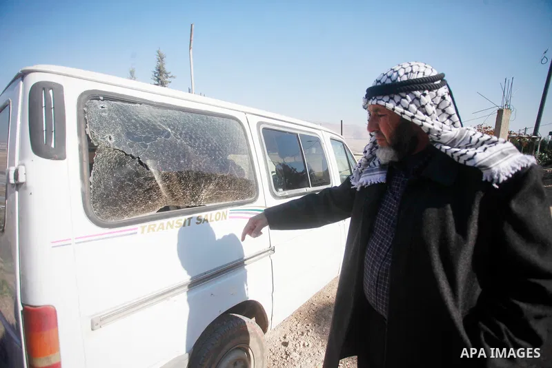 Palestinians inspect bloodstains and debris outside a house in the northern West Bank village of Tamoun, after an Israeli drone strike killed three members of a Palestinian family, January 8, 2025. Photo by Mohammed Nass...