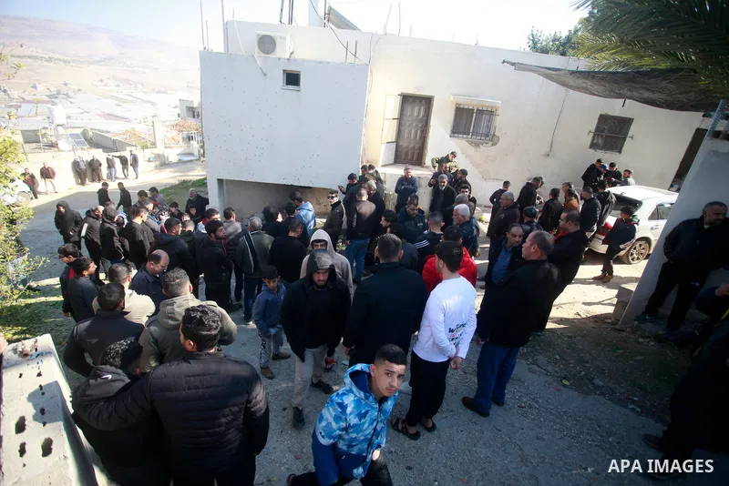 Palestinians inspect bloodstains and debris outside a house in the northern West Bank village of Tamoun, after an Israeli drone strike killed three members of a Palestinian family, January 8, 2025. Photo by Mohammed Nass...