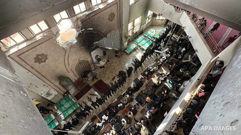 People perform Friday prayers and funeral prayers in absentia for the members of the Al-Qassam Brigades (the armed wing of the Palestinian group Hamas) in Khan Yunis, Gaza on January 31, 2025. Photo by Doaa el-Baz\ apaim...