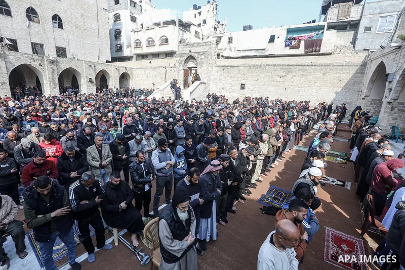 People perform absentee funeral prayer for the military commander of the Al-Qassam Brigades (the armed wing of the Palestinian group Hamas) Mohammed Deif, at the Great Mosque of Gaza in Gaza City, Gaza on January 31, 202...
