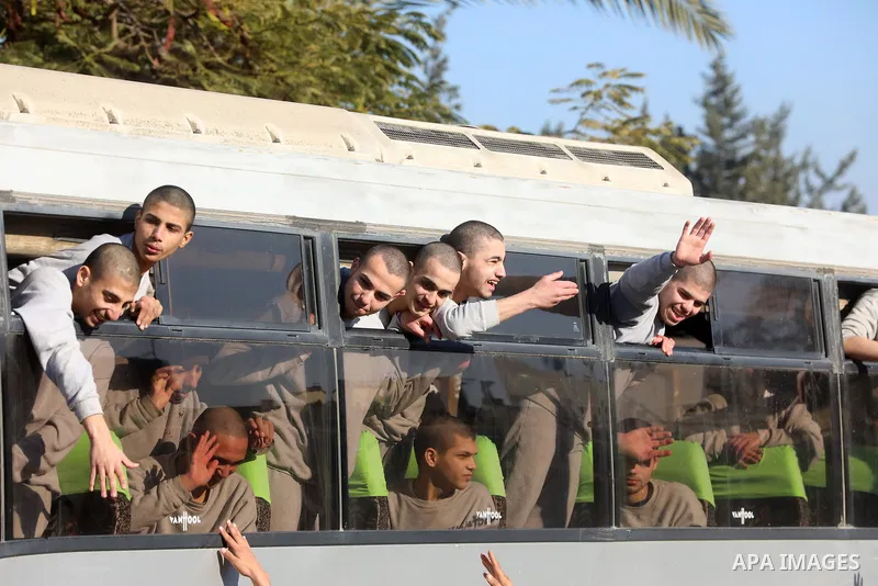 A bus carrying former Palestinian prisoners arrives at the European Hospital in Khan Yunis in the southern Gaza Strip on February 27, 2025, following their release by Israeli authorities. Hamas handed over the coffins of...