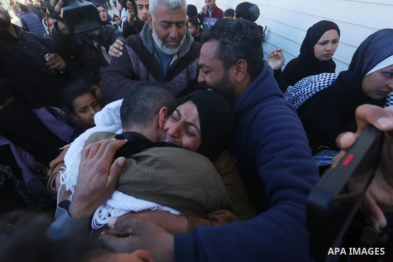 Palestinians prisoners are embraced by members of thier family at the European Hospital in Khan Yunis in the southern Gaza Strip on February 27, 2025, following his release by Israeli authorities. Hamas handed over the c...