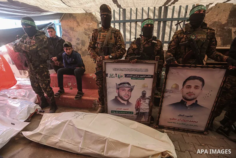 Al-Qassam Brigades members attend the funeral for the members of the Al-Qassam Brigades (the armed wing of the Palestinian group Hamas) at Shati Refugee Camp in Gaza City, Gaza on February 28, 2025. Photo by Omar Ashtawy...