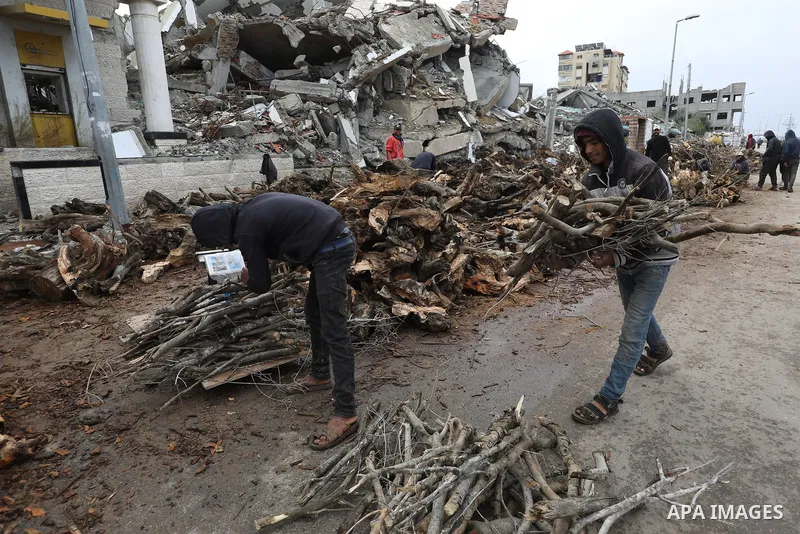 Palestinians chops wood as Palestinians start to use wood instead of liquefied petroleum gas due to shortage of gas cylinders and fuel in Al-Bureij Refugee Camp, Gaza Strip, on March 22, 2025. Following closure of the Ke...