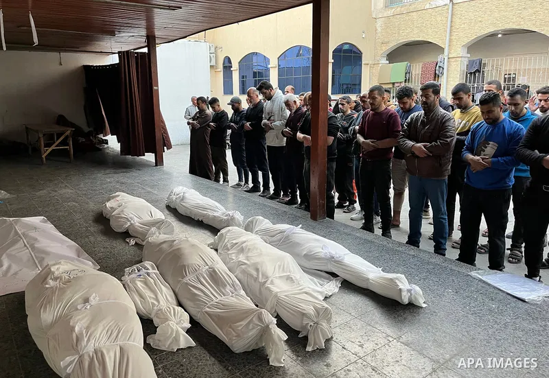 Palestinians mourn the deaths of nine members of the Hamada family at Al-Ahli Baptist Hospital, after Israeli warplanes targeted their home on Jaffa Street in the Al-Daraj neighborhood east of Gaza City, on 31 Mach 2025....