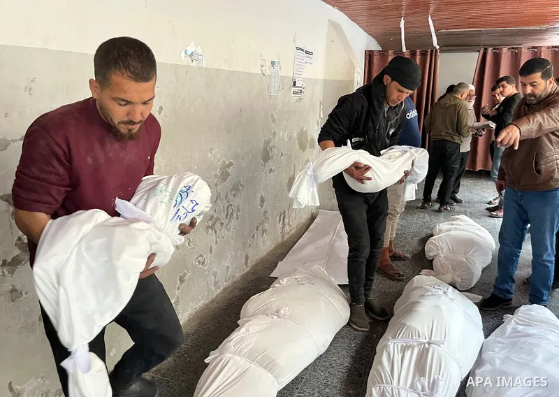 Palestinians mourn the deaths of nine members of the Hamada family at Al-Ahli Baptist Hospital, after Israeli warplanes targeted their home on Jaffa Street in the Al-Daraj neighborhood east of Gaza City, on 31 Mach 2025....