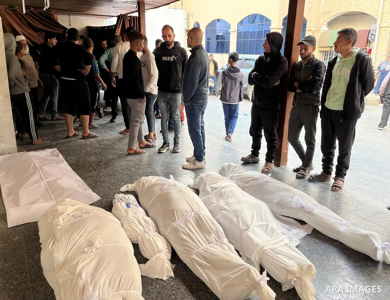 Palestinians mourn the deaths of nine members of the Hamada family at Al-Ahli Baptist Hospital, after Israeli warplanes targeted their home on Jaffa Street in the Al-Daraj neighborhood east of Gaza City, on 31 Mach 2025....
