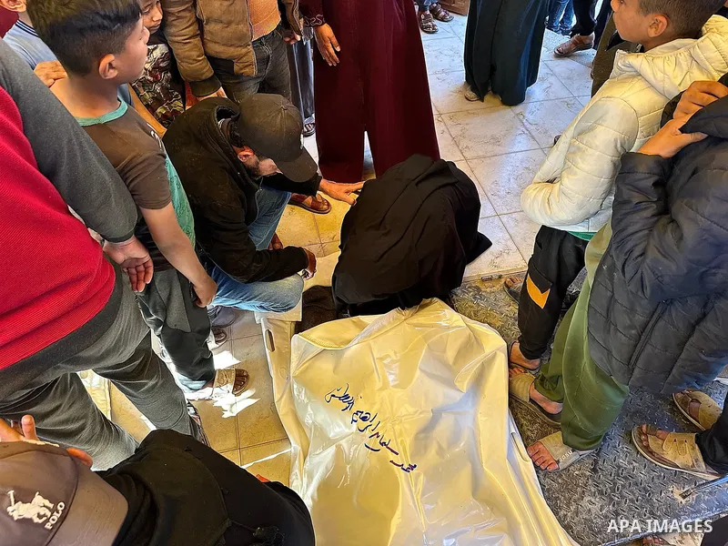 The bodies of the Palestinians, who lost their lives in the Israeli strike in the southern Gaza Strip, are seen at the of the Nasser Hospital in Khan Yunis, Gaza Strip, where grieving relatives of the deceased are mourni...