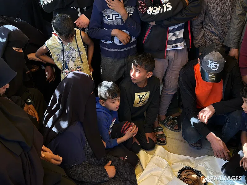 The bodies of the Palestinians, who lost their lives in the Israeli strike in the southern Gaza Strip, are seen at the of the Nasser Hospital in Khan Yunis, Gaza Strip, where grieving relatives of the deceased are mourni...