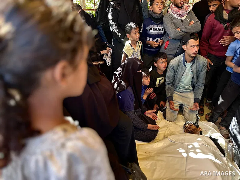 The bodies of the Palestinians, who lost their lives in the Israeli strike in the southern Gaza Strip, are seen at the of the Nasser Hospital in Khan Yunis, Gaza Strip, where grieving relatives of the deceased are mourni...