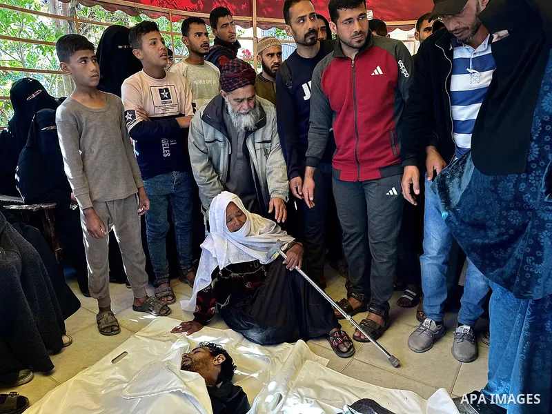 The bodies of the Palestinians, who lost their lives in the Israeli strike in the southern Gaza Strip, are seen at the of the Nasser Hospital in Khan Yunis, Gaza Strip, where grieving relatives of the deceased are mourni...
