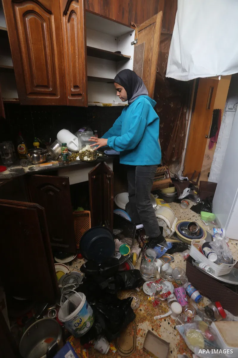 Members of a Palestinian family inspect their destroyed home in the Balata al-Balad neighborhood, east of Nablus, in the West Bank, following an Israeli military operation, April 30, 2025. Photo by Mohammed Nasser\ apaim...