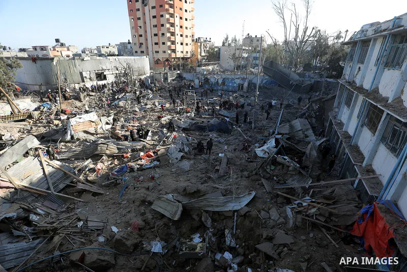 Palestinians inspect the damage caused by an Israeli airstrike targeting a school housing displaced people for the second time in Al-Bureij refugee camp in the central Gaza Strip, on May 7, 2025. Photo by Moiz Salhi \ ap...