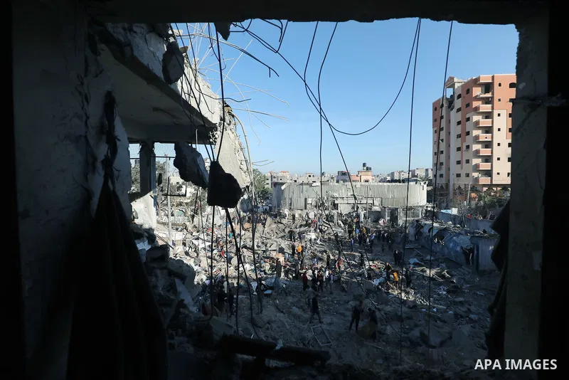 Palestinians inspect the damage caused by an Israeli airstrike targeting a school housing displaced people for the second time in Al-Bureij refugee camp in the central Gaza Strip, on May 7, 2025. Photo by Moiz Salhi \ ap...