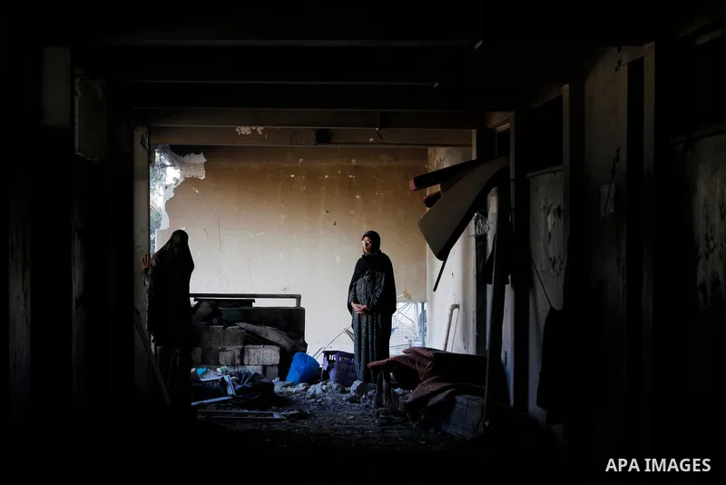 Palestinians inspect the damage caused by an Israeli airstrike targeting a school housing displaced people for the second time in Al-Bureij refugee camp in the central Gaza Strip, on May 7, 2025. Photo by Moiz Salhi \ ap...