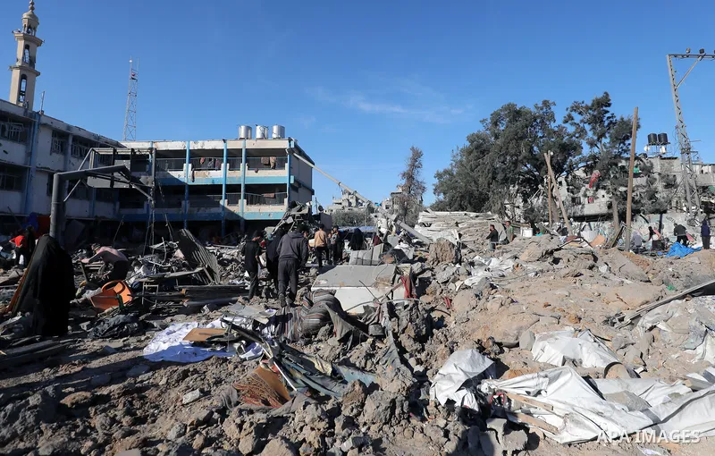Palestinians inspect the damage caused by an Israeli airstrike targeting a school housing displaced people for the second time in Al-Bureij refugee camp in the central Gaza Strip, on May 7, 2025. Photo by Moiz Salhi \ ap...