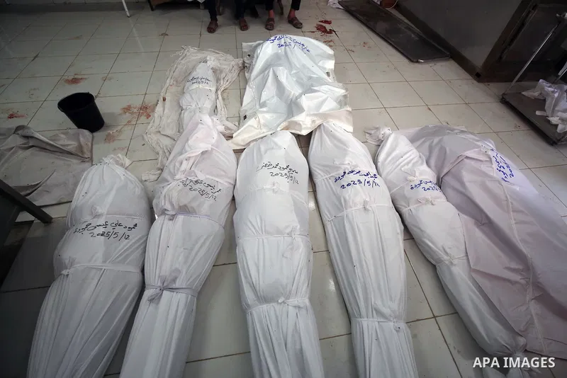 Palestinians mourn the loss of their loved ones killed in an Israeli attack on A school Fatima, Asad's daughter, who shelters the displaced in Jabalia, after they are brought to Indonesian Hospital, North Gaza Strip, on...