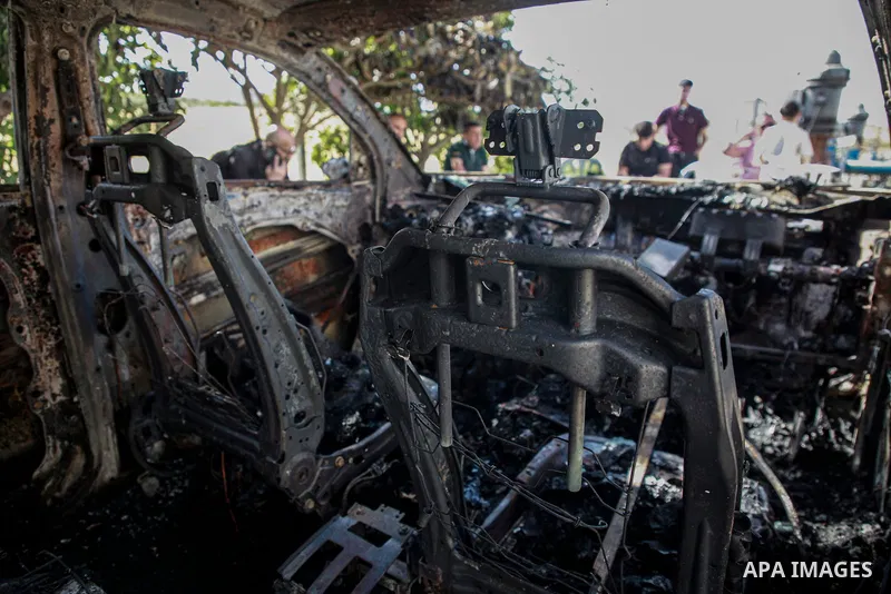 Burnt-out vehicles at the scene of an attack by Israeli settlers, in the village of Burqa north of the West Bank city of Nablus, 16 May 2025. According to the WAFA News Agency, Israeli settlers set fire to around 17 Pale...