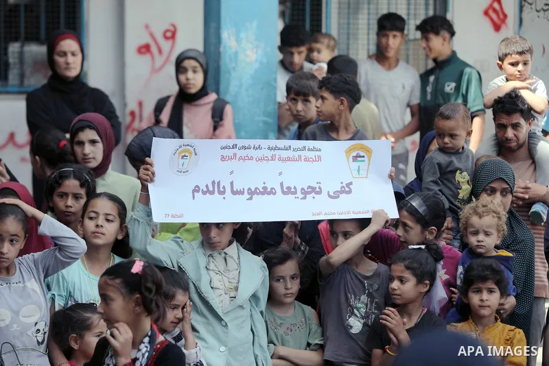 Palestinians participate in a solidarity stand in support of UNRWA, in light of the ongoing campaign against it at the Abu Helou East School in Al-Bureij camp, central Gaza Strip. Photo by Moiz Salhi \ apaimages