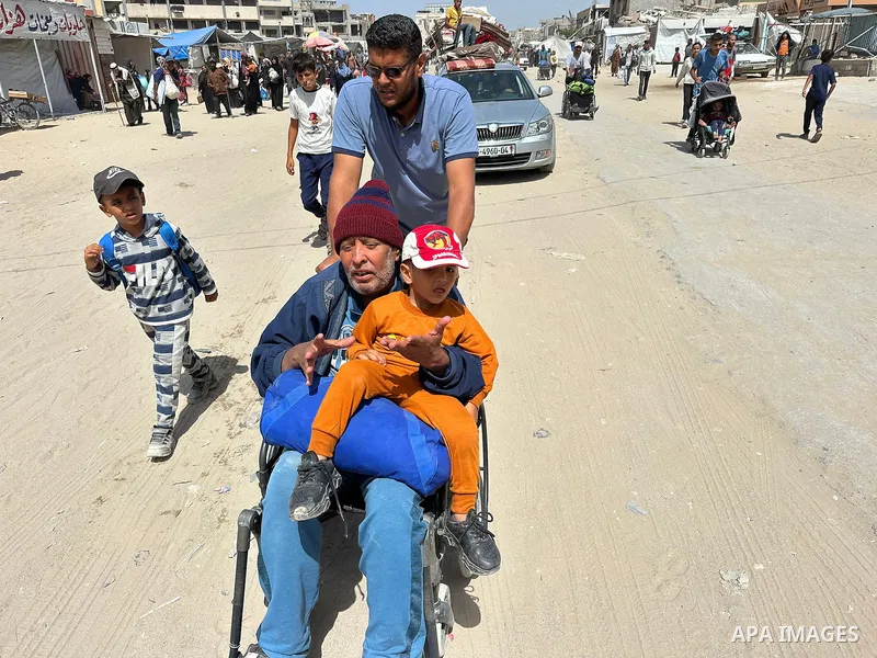 Palestinians move to the coastal area of al-Mawasi with their belongings, after the Israeli army ordered the evacuation of a large area announcing that they would launch an attack on Khan Yunis, on May 19, 2025. Photo by...