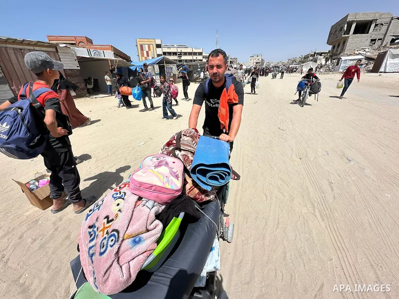 Palestinians move to the coastal area of al-Mawasi with their belongings, after the Israeli army ordered the evacuation of a large area announcing that they would launch an attack on Khan Yunis, on May 19, 2025. Photo by...