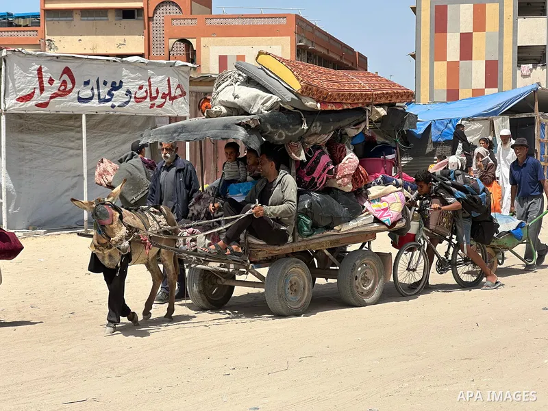Palestinians move to the coastal area of al-Mawasi with their belongings, after the Israeli army ordered the evacuation of a large area announcing that they would launch an attack on Khan Yunis, on May 19, 2025. Photo by...