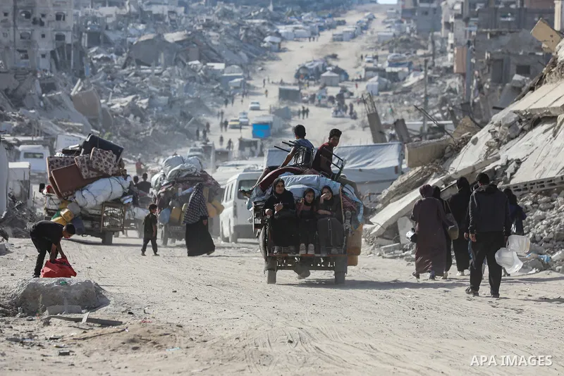 Palestinian residents fleeing toward areas they believe to be safer, carrying their belongings, following heavy Israeli attacks on the Beit Lahia and Jabalia areas in northern Gaza, on May 19, 2025. Photo by Omar Ashtawy...