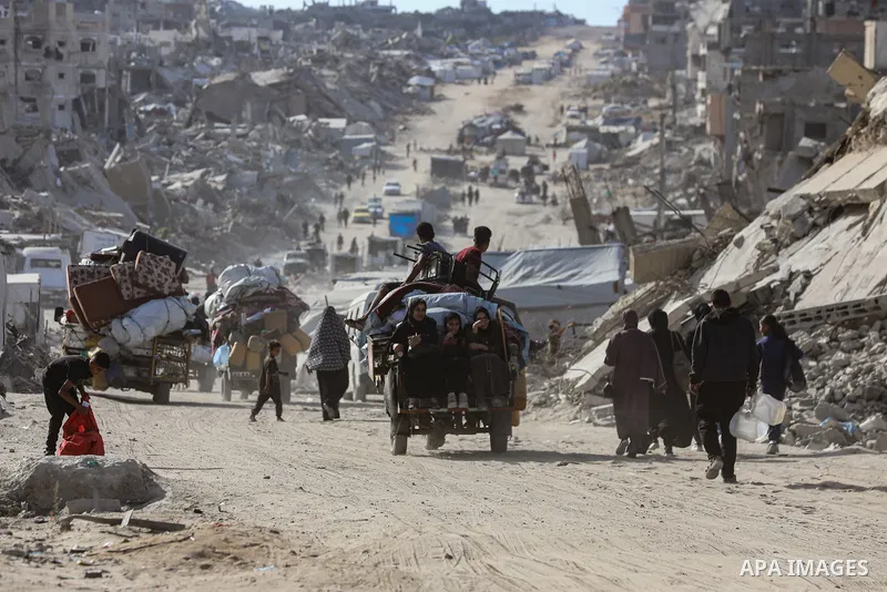 Palestinian residents fleeing toward areas they believe to be safer, carrying their belongings, following heavy Israeli attacks on the Beit Lahia and Jabalia areas in northern Gaza, on May 19, 2025. Photo by Omar Ashtawy...