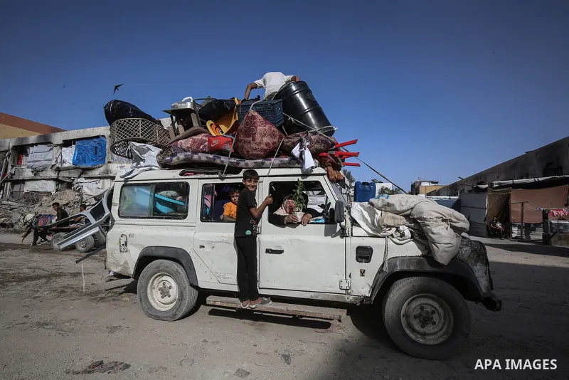 Palestinian residents fleeing toward areas they believe to be safer, carrying their belongings, following heavy Israeli attacks on the Beit Lahia and Jabalia areas in northern Gaza, on May 19, 2025. Photo by Omar Ashtawy...