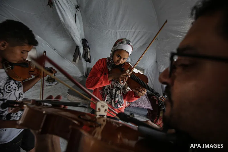 Volunteer teachers provide lessons in oud, violin, and darbuka to children displaced by Israel's ongoing attacks since October 7, 2023, helping them temporarily forget the negative effects of the conflict in the Gaza Str...
