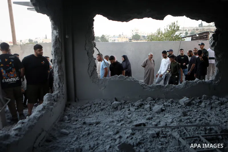 A view of the completely demolished home of Ezzeddin al-Mesalma, along with nearby damaged houses, is seen after Israeli forces carried out a punitive demolition in the town of Beit Awwa, Hebron, West Bank, on June 17, 2...