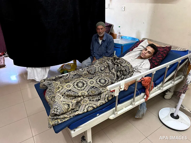 Palestinian Ibrahim Adly Abu Zeid (17 years old), displaced from Rafah and currently residing in Al-Mawasi, Khan Younis, is receiving medical care at Nasser Hospital in Khan Younis after being shot twice in his left leg...