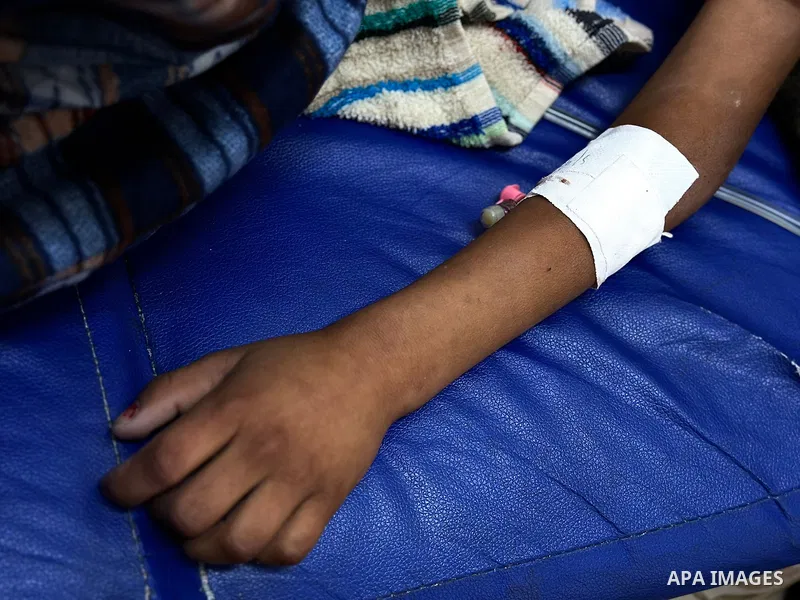 Palestinian child Mais Abdel Aal, 10 years old and displaced to the Al-Mawasi area west of Khan Younis, is receiving medical care at Nasser Medical Complex after being shot by a drone while inside the tent sheltering her...