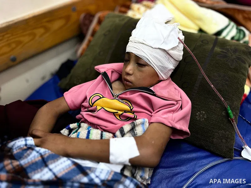 Palestinian child Mais Abdel Aal, 10 years old and displaced to the Al-Mawasi area west of Khan Younis, is receiving medical care at Nasser Medical Complex after being shot by a drone while inside the tent sheltering her...