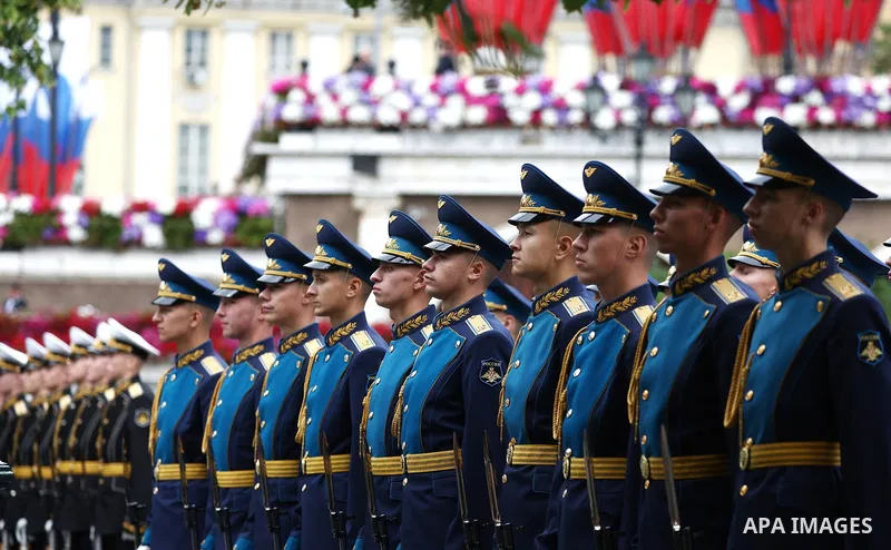 Russia's President Vladimir Putin and Russian Defence Minister Andrei Belousov attend a wreath-laying ceremony at the Tomb of the Unknown Soldier in the Alexandrovsky Garden near the Kremlin wall to commemorate the 84th...
