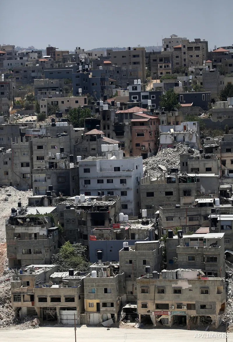 Israeli army heavy machinery demolishes a home at the Nur Shams Palestinian refugee camp, east of Tulkarem, in the Israeli occupied West Bank on June 25, 2025, during an ongoing military operation in the north of the Pal...