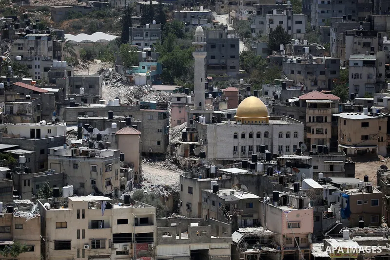 Israeli army heavy machinery demolishes a home at the Nur Shams Palestinian refugee camp, east of Tulkarem, in the Israeli occupied West Bank on June 25, 2025, during an ongoing military operation in the north of the Pal...