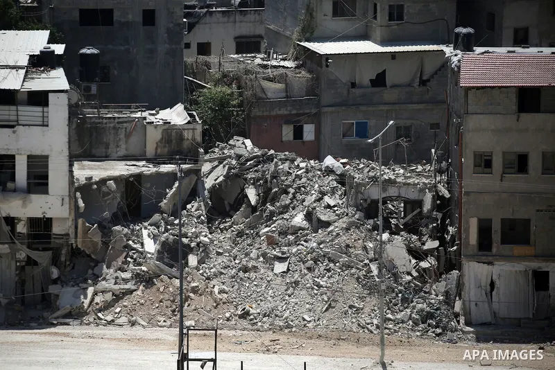 Israeli army heavy machinery demolishes a home at the Nur Shams Palestinian refugee camp, east of Tulkarem, in the Israeli occupied West Bank on June 25, 2025, during an ongoing military operation in the north of the Pal...