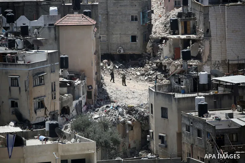Israeli army heavy machinery demolishes a home at the Nur Shams Palestinian refugee camp, east of Tulkarem, in the Israeli occupied West Bank on June 25, 2025, during an ongoing military operation in the north of the Pal...