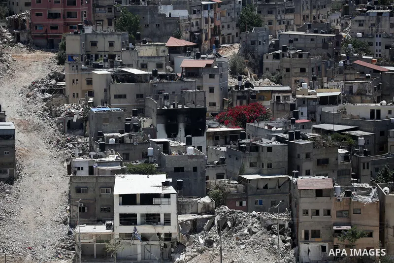 Israeli army heavy machinery demolishes a home at the Nur Shams Palestinian refugee camp, east of Tulkarem, in the Israeli occupied West Bank on June 25, 2025, during an ongoing military operation in the north of the Pal...