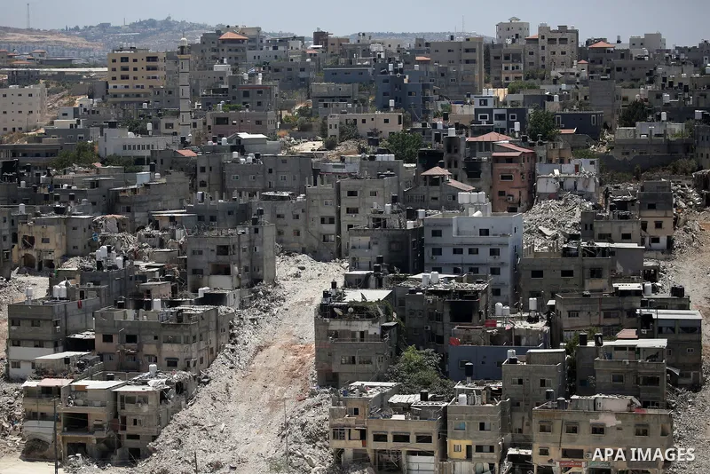 Israeli army heavy machinery demolishes a home at the Nur Shams Palestinian refugee camp, east of Tulkarem, in the Israeli occupied West Bank on June 25, 2025, during an ongoing military operation in the north of the Pal...