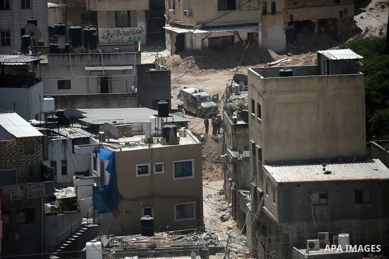 Israeli army heavy machinery demolishes a home at the Nur Shams Palestinian refugee camp, east of Tulkarem, in the Israeli occupied West Bank on June 25, 2025, during an ongoing military operation in the north of the Pal...